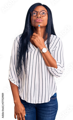 Fotografie Young african american woman wearing casual clothes and glasses thinking concent