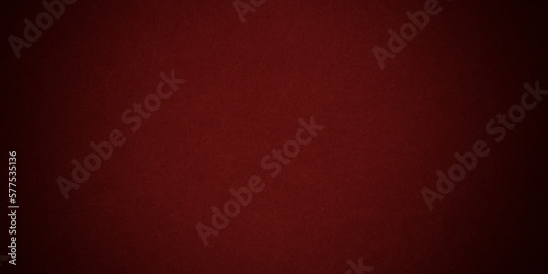 Red background in Christmas or valentines day red color with vintage texture and shiny spot light