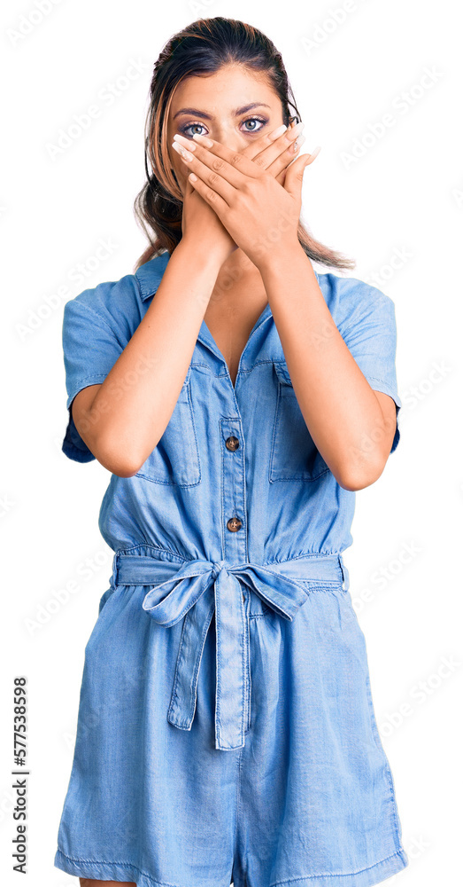 Young beautiful woman wearing casual clothes shocked covering mouth with hands for mistake. secret concept. Young beautiful woman wearing casual clothes shocked covering mouth with hands for mistake. secret concept.
