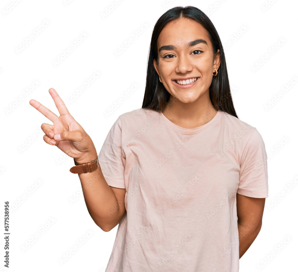 Young asian woman wearing casual clothes showing and pointing up with fingers number two while smiling confident and happy. Young asian woman wearing casual clothes showing and pointing up with fingers number two while smiling confident and happy.