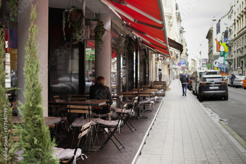 Street cafe with wooden terrace furniture. tables and chairs at restaurant