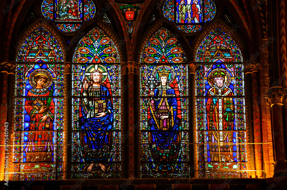 Stained glass windows with Jesus, Virgin Mary and apostles at Cahors Cathedral. Cahors, France. Cahors Cathedral is one of the French sites on Routes of Santiago de Compostela. 