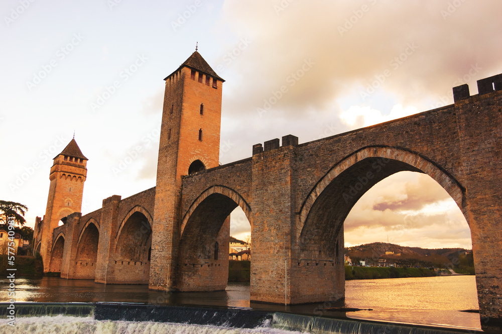 Cahors, France. Valentre bridge with its picturesque towers over Lot river at sunset. Valentre Bridge is part of the Santiago Pilgrim route and listed as UNESCO World Heritage Site