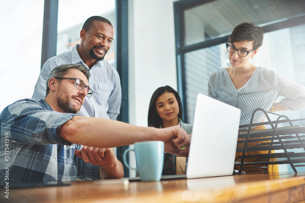 Working together to get the task done. Shot of businesspeople working together in the office. Working together to get the task done. Shot of businesspeople working together in the office.