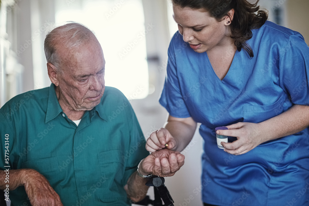 Dedicated to personal quality care. Shot of a female nurse assisting