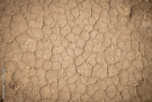 Dry desert ground cracked from the scorching sun.