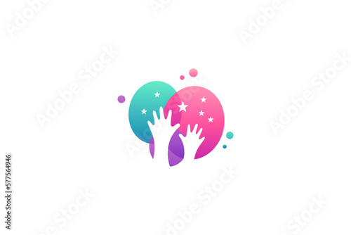 Child's hand reaching for the star logo with various colorful bubble shapes