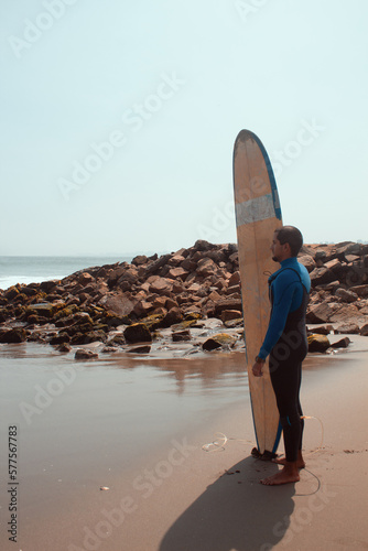 surfer getting ready to enter the sea photo