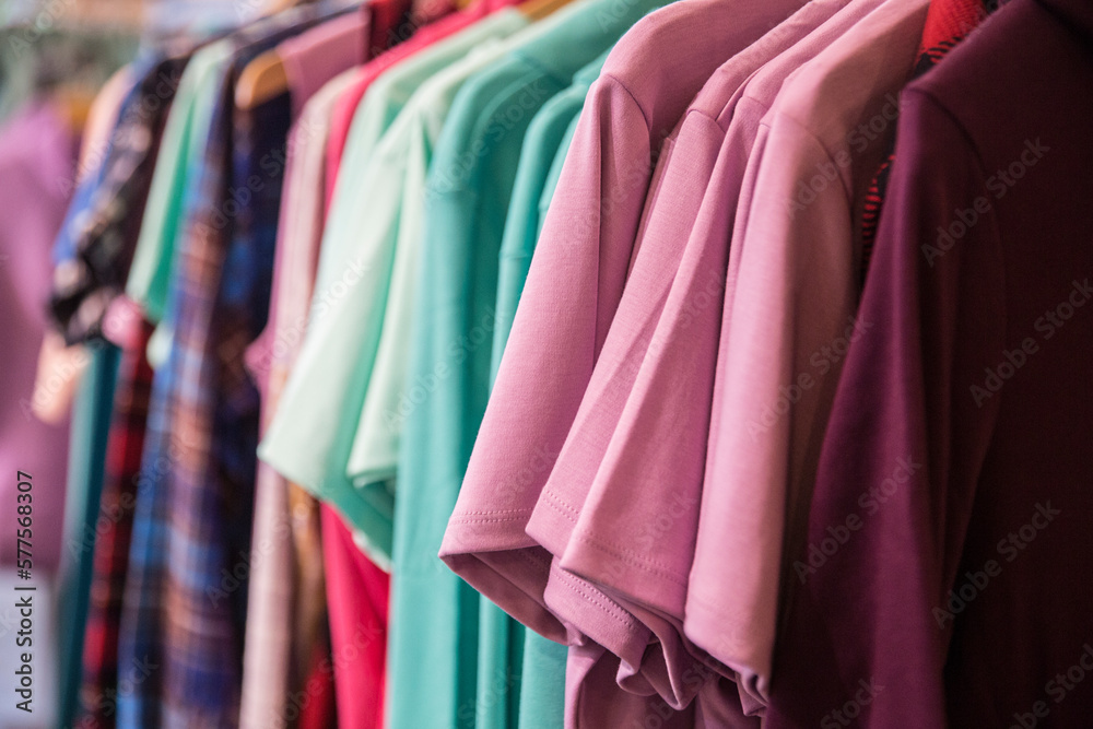 Different style of clothes displayed in a shop Different style of clothes displayed in a shop