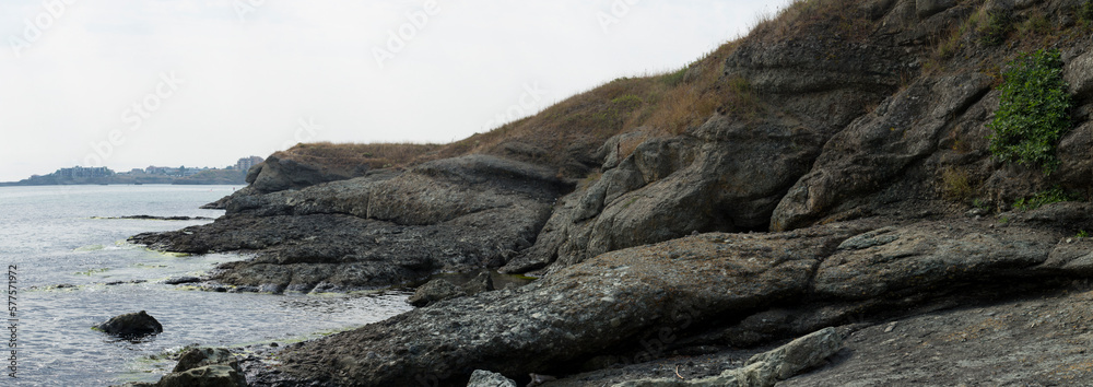 Black Sea coast. A seashore formed by frozen volcanic lava. Tectonic rocks. Black Sea coast. A seashore formed by frozen volcanic lava. Tectonic rocks.