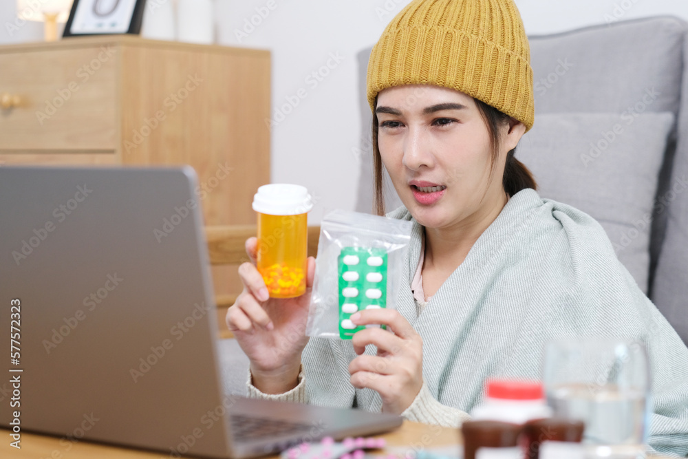 Asian woman patient make video call counseling doctor about healthcare by laptop computer, Telemedicine, Pharmacist