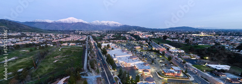 An Aerial View of the Sun Going Down over Yucaipa, California, with a Super market Shopping Complex and Traffic Below © Gary Peplow