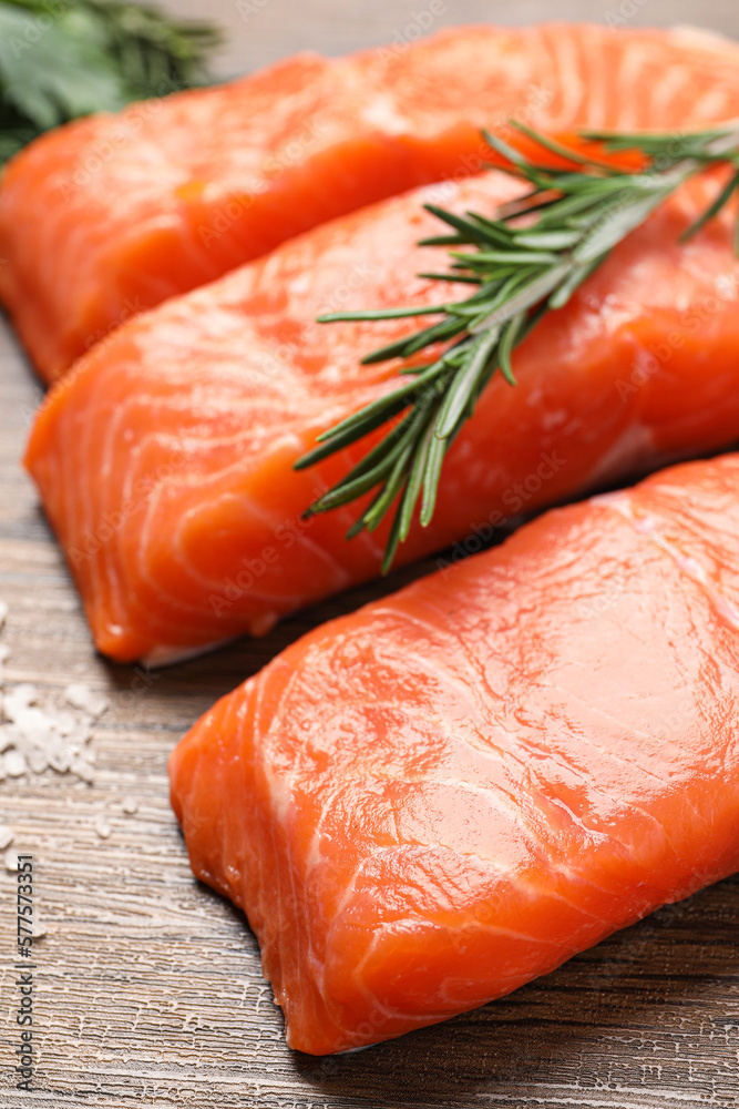 Fresh salmon and ingredients for marinade on wooden table, closeup
