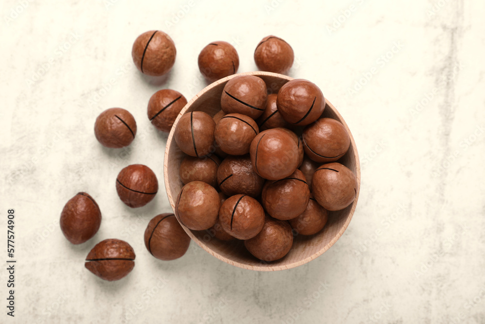 Delicious organic Macadamia nuts on light gray table, flat lay Delicious organic Macadamia nuts on light gray table, flat lay