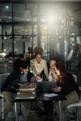 Designing your dreams. Shot of a group of young designers working late in the office.