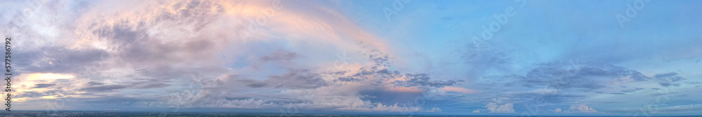 The blue sky is covered with blue and soft pink clouds in evening light.