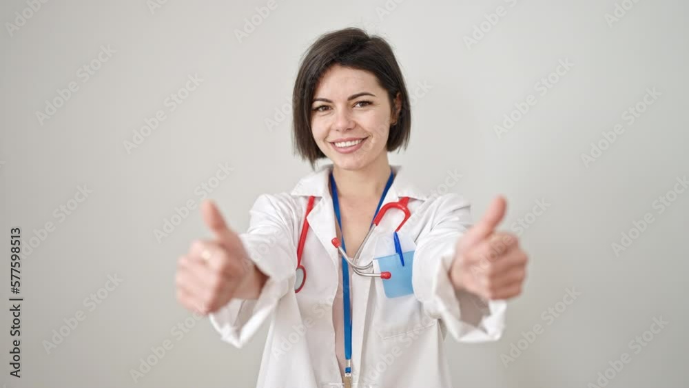 Young caucasian woman doctor doing thumbs up over isolated white background Young caucasian woman doctor doing thumbs up over isolated white background