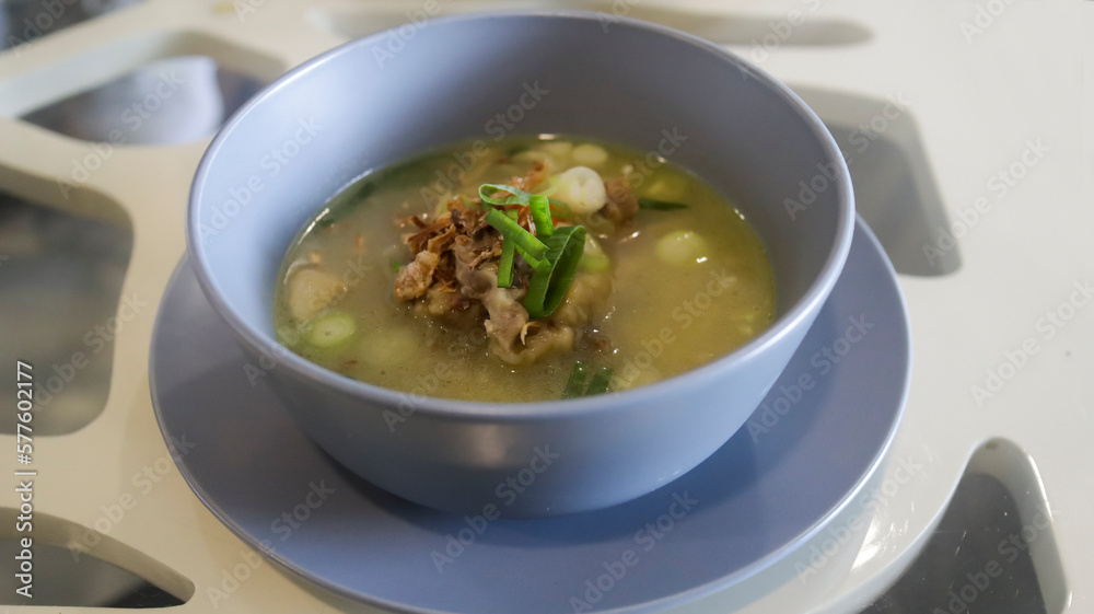 Oxtail soup is a soup made with beef tails served in a table