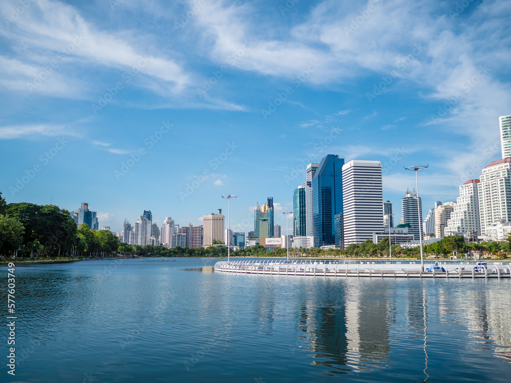 Obraz premium Benjakitti Park with a cityscape in Bangkok, Thailand.
