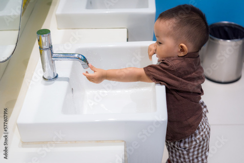 Fotografija Baby kid washing hands in bathroom