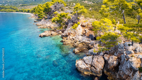 Take in the breathtaking aerial view of Makarska Riviera in Croatia, revealing a picturesque rocky beach and the vibrant turquoise water.