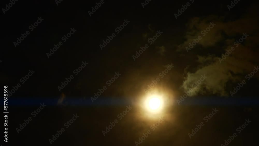 Timelapse of full moon, dark dramatic clouds in night sky, anamorphic time lapse Timelapse of full moon, dark dramatic clouds in night sky, anamorphic time lapse