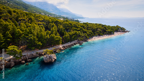 Fototapeta Naklejka Na Ścianę i Meble -  Marvel at the stunning aerial perspective of Croatia's Makarska Riviera, displaying a rocky beach and the captivating turquoise water.