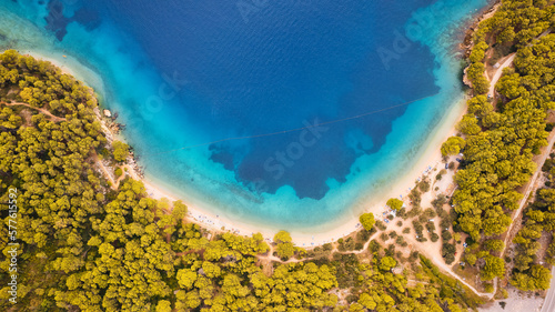 Marvel at the stunning aerial perspective of Croatia's Makarska Riviera, displaying a rocky beach and the captivating turquoise water.