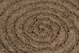 Spiral poured ground black pepper background. Dry seasoning pepper. Spices and herbs for cooking, pepper powder