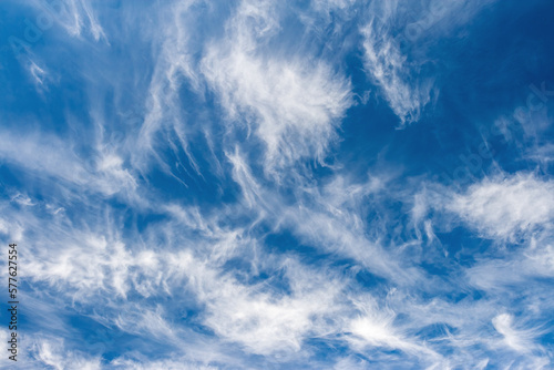 Blue sky background with awesome white clouds in the sunny day.