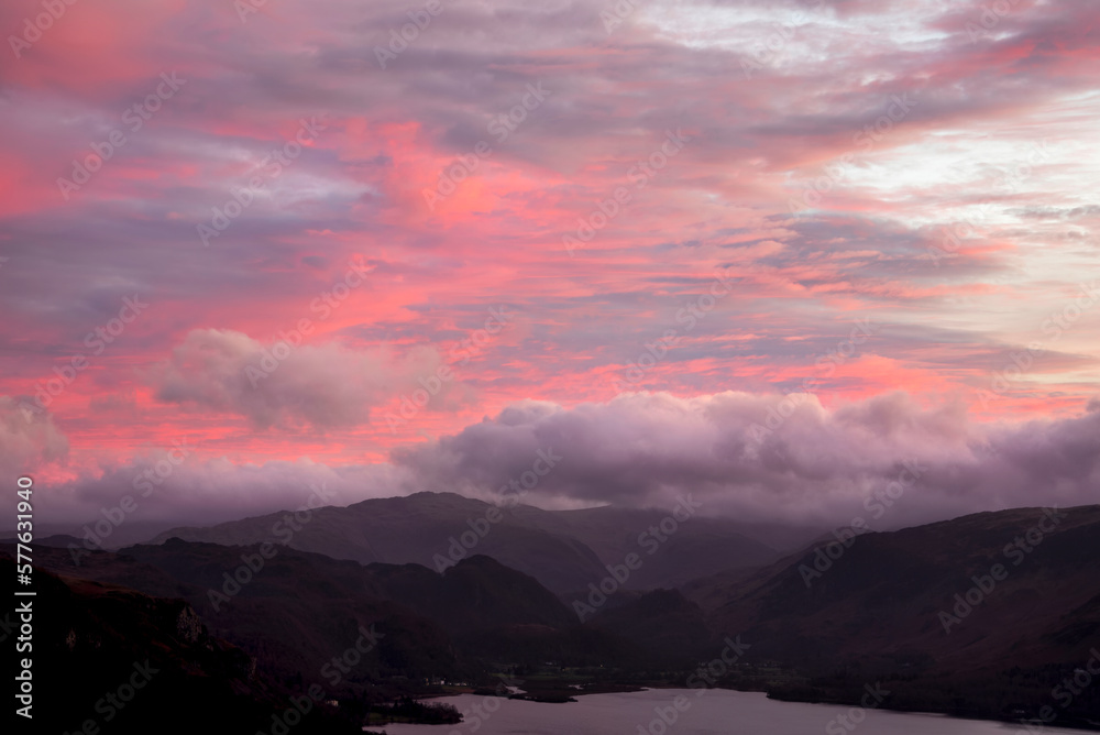 Absolutely wonderful landscape image of view across Derwentwater from Latrigg Fell in lake District during Winter beautiful colorful sunset