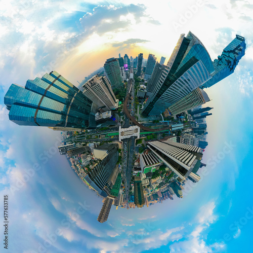 Aerial view of Skywalk Chong Nonsi road intersection with traffic jams on the city skyline at dusk.