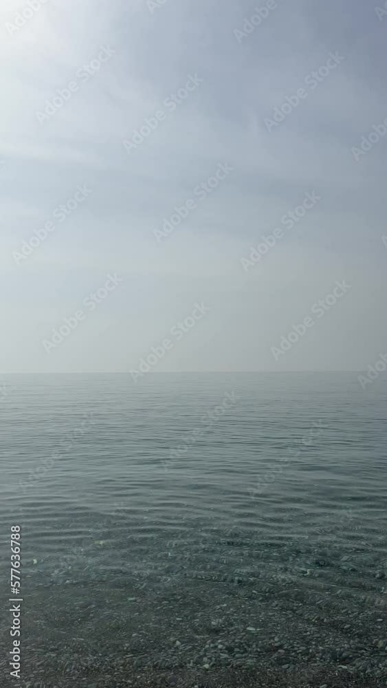 Calm sea waves with morning dusty sky. Calm sea waves with morning dusty sky.