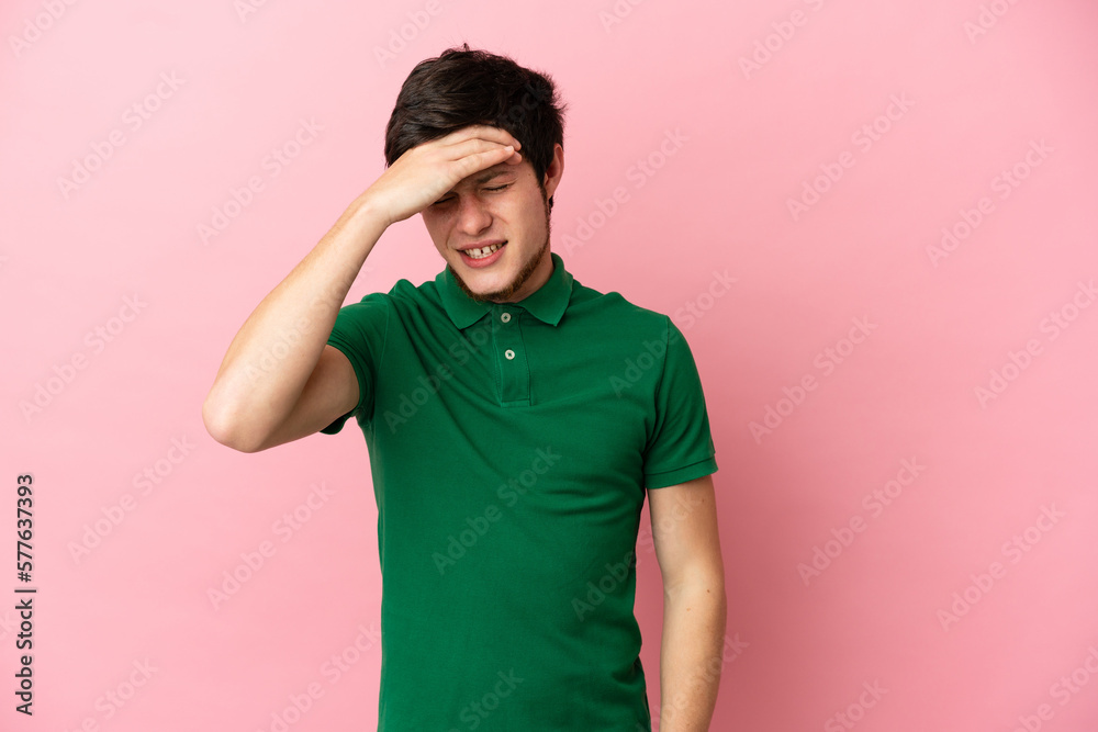 Young Russian man isolated on pink background with headache Young Russian man isolated on pink background with headache