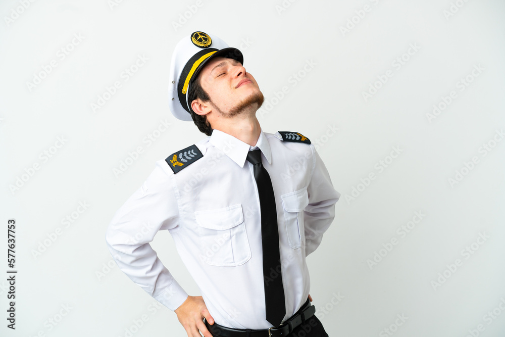 Airplane Russian pilot isolated on white background suffering from backache for having made an effort Airplane Russian pilot isolated on white background suffering from backache for having made an effort