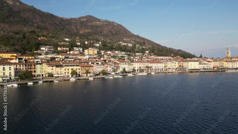Europe, Italy, Brescia , Garda lake , Salo' drone aerial view of village with church and lake with blue water - Italian Republic from 1943 to 1945 during the reign of Benito Mussolini fascist Europe, Italy, Brescia , Garda lake , Salo' drone aerial view of village with church and lake with blue water - Italian Republic from 1943 to 1945 during the reign of Benito Mussolini fascist