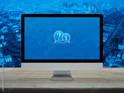 Принти на полотні Question mark and information chat icon on desktop computer monitor screen on wo