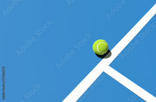 Fototapeta Naklejka Na Ścianę i Meble -  Green tennis ball on the blue court line. Tennis sport and tournament concept.
