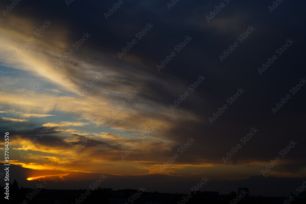 dramatic sunset. color. background with clouds.