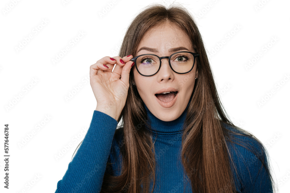 Wow! I don't believe you! A close-up portrait of shocked Swedish girl, amazed woman with open mouth, big eyes, she touches glasses in surprise expression over transparent background. People emotions Wow! I don't believe you! A close-up portrait of shocked Swedish girl, amazed woman with open mouth, big eyes, she touches glasses in surprise expression over transparent background. People emotions