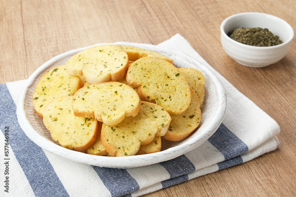 Toasted Garlic Bread, made of sliced bread with garlic, cheese and herbs Toasted Garlic Bread, made of sliced bread with garlic, cheese and herbs