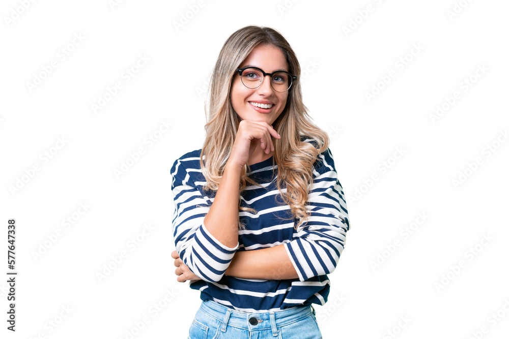 Young Uruguayan woman over isolated background thinking an idea while looking up Young Uruguayan woman over isolated background thinking an idea while looking up