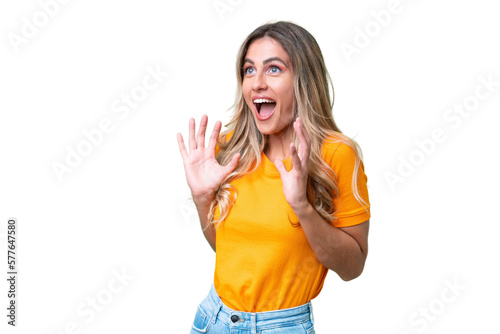 Young Uruguayan woman over isolated background with surprise facial expression photo