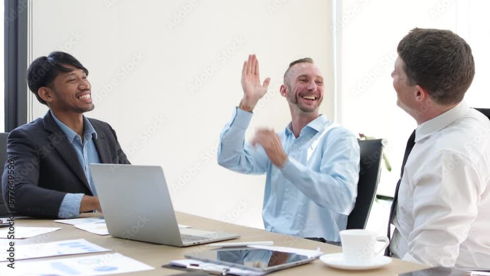 Group of business people at the meeting congratulate and get excited when a new project is successful. Group of business people at the meeting congratulate and get excited when a new project is successful.