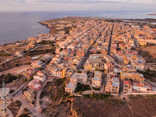 Aerial drone. Rocky coastline and island at Portopalo di Capo Passero, Siracusa Province, Sicily.