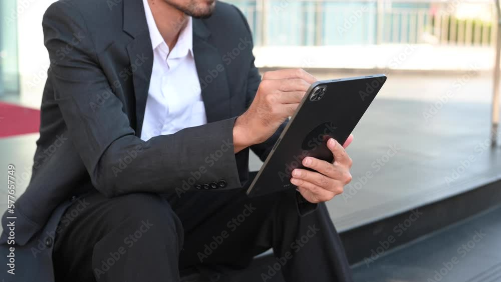 Businessman hand using smart phone laptop and tablet with social network diagram on desk as concept in morning light.. Businessman hand using smart phone laptop and tablet with social network diagram on desk as concept in morning light..