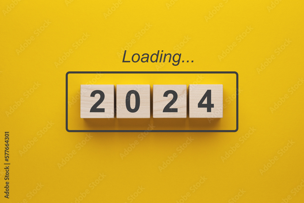 2024 new year loading. Wooden cubes with 2024 on a yellow background