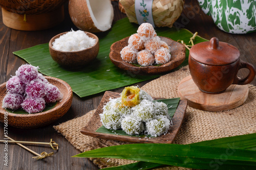 Klepon or kelepon, is a snack of sweet rice cake balls filled with molten palm sugar and coated in grated coconut.