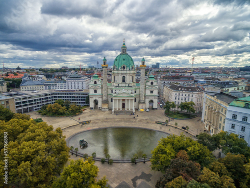 Vienna Karlskirche Church with Resselpark park and Cloudy Sky. Austria