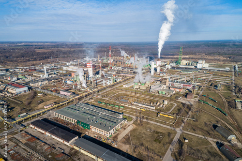 Chemistry Factory in Lithuania, Achema in Jonava City. Clear Blue Sky and Smoke in background. Drone